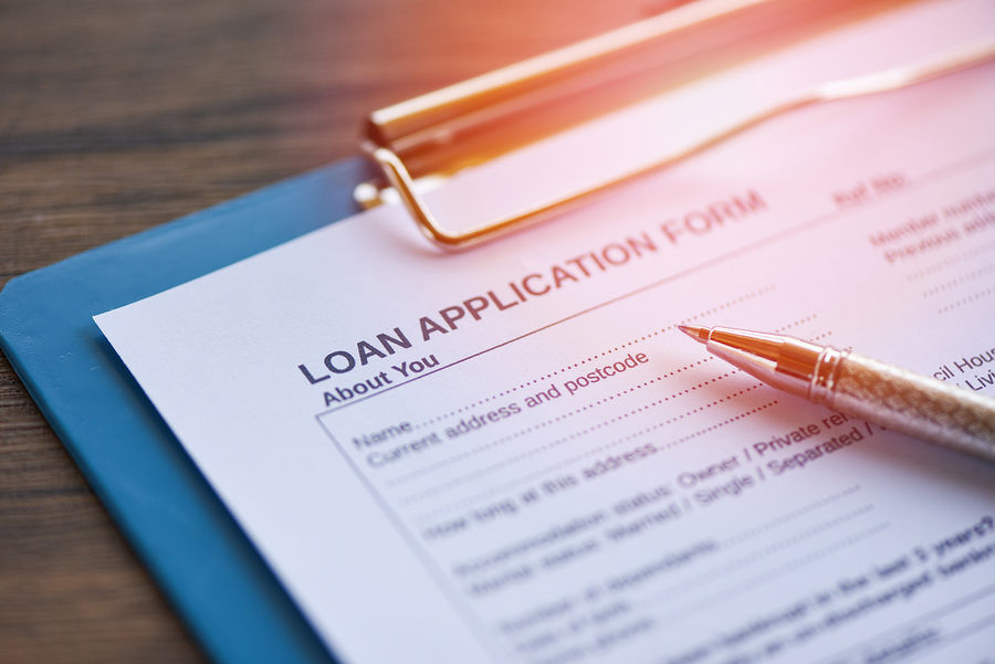 Loan Application Form With Pen On Paper / Financial Loan Negotiation For Lender And Borrower On Busi